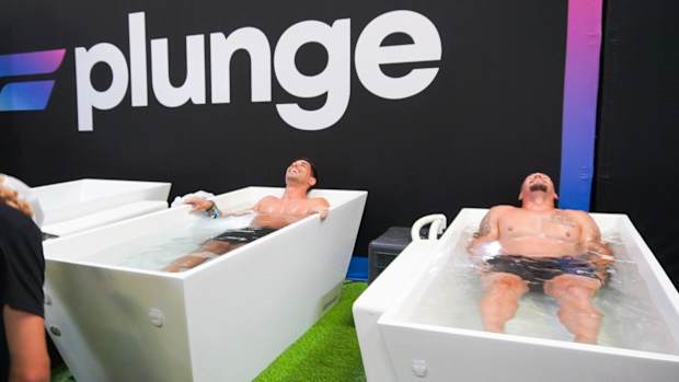 Two Plunge Cold Plunge tubs side by side being used by men.